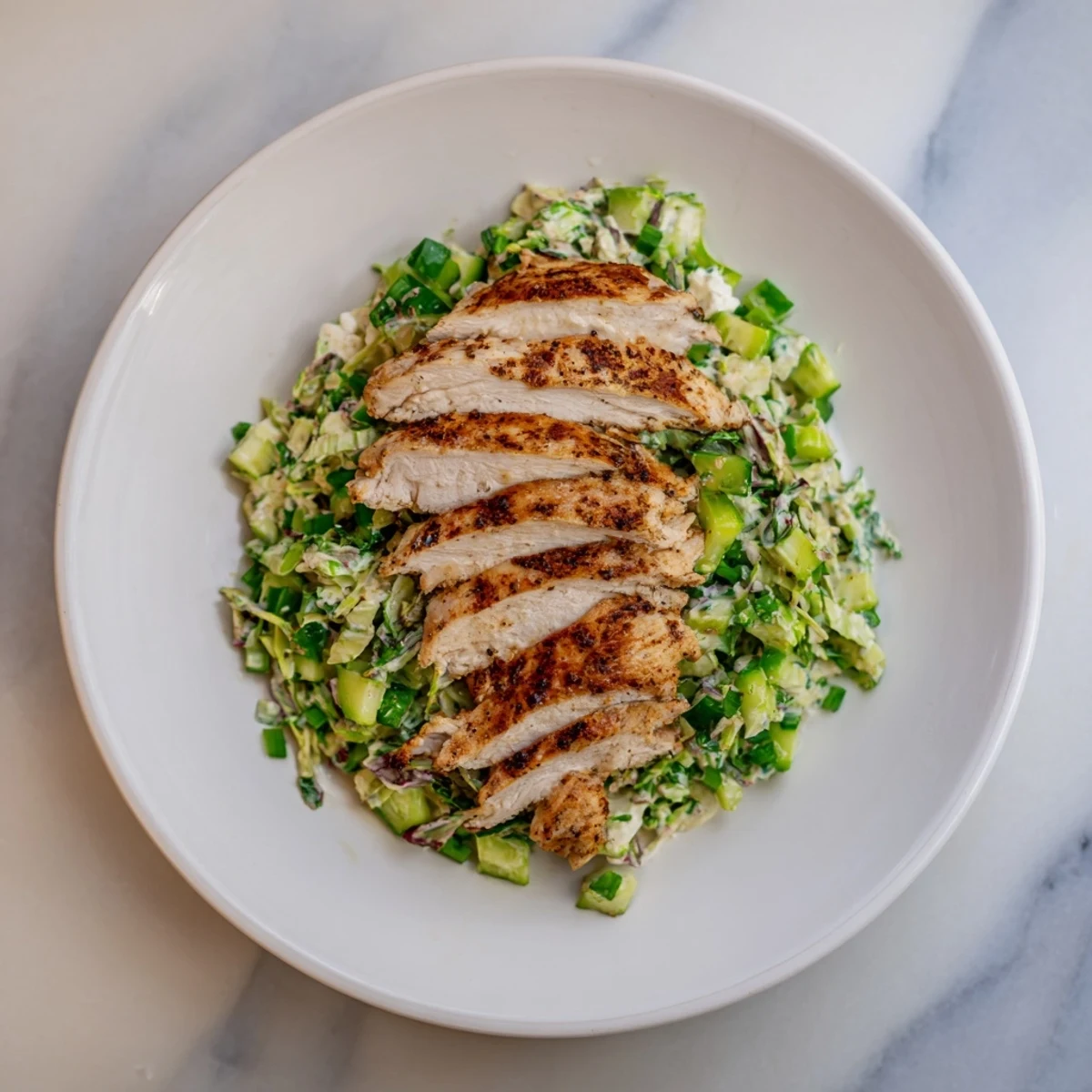 Freshly made Green Goddess Chicken Wraps, showcasing juicy grilled chicken with colorful cabbage.