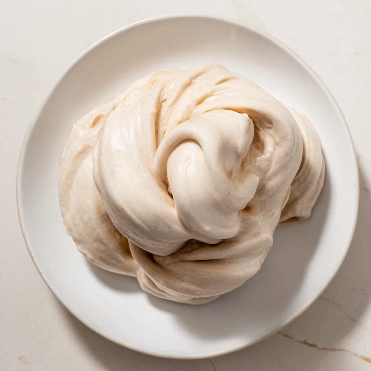 A close-up of creamy 2-Ingredient Banana Ice Cream, ready to be enjoyed as a refreshing treat.
