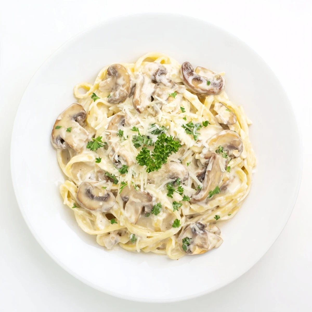 Sautéed golden cremini mushrooms and minced garlic simmer in rich cream, tossed with al dente pasta and finished with nutmeg for a velvety texture.