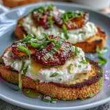 Honey peach burrata toast with golden sourdough, creamy cheese, and juicy peach slices drizzled with honey and olive oil.