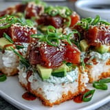 Vibrant crispy rice salad featuring avocado and spicy tuna, ready to serve.