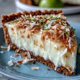 Bright Coconut Lime Tart with a golden graham cracker crust.