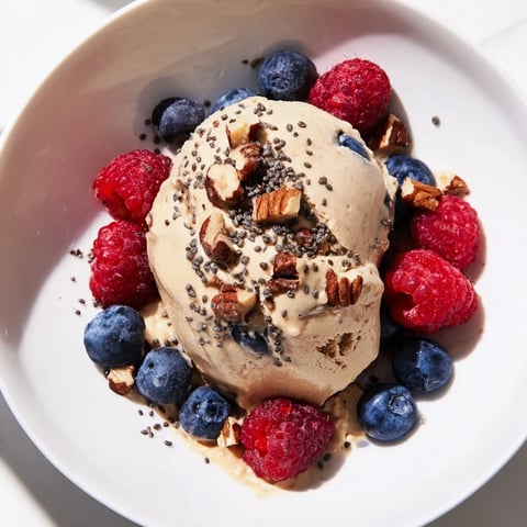 Creamy Protein Ice Cream Bowl with fresh berries visually enticing, a healthy treat for the summer.