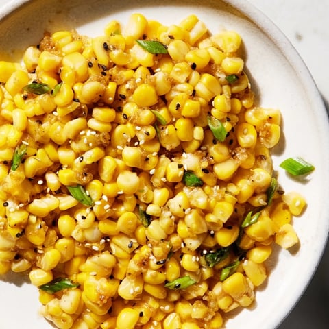 Golden Japanese Butter Corn glistens, seasoned with soy sauce, ready to serve as a side.