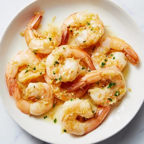 Enjoy a steaming bowl of 15-Minute Garlic Shrimp Scampi, a flavorful and easy weeknight dinner.