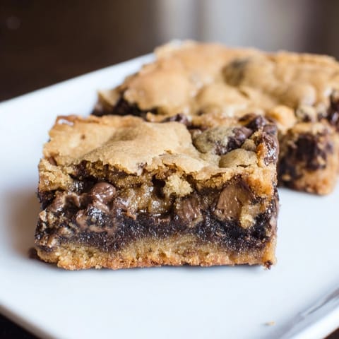 Golden-brown, delicious Ultimate Gooey Chocolate Chip Cookie Bars—perfectly chewy and loaded with chocolate.