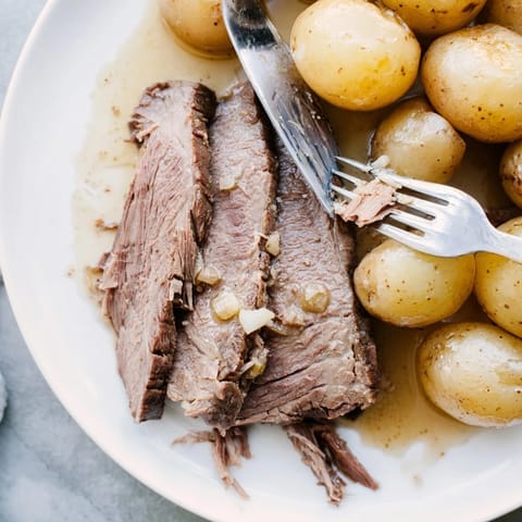 Fork-tender 4-ingredient slow cooker pot roast, a classic, comforting American main dish.