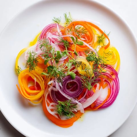 A vibrant close-up of the "Spinning Top" salad, a refreshing appetizer with crisp vegetables.