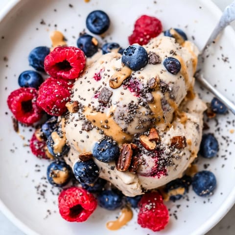 A close-up of a Protein Ice Cream Bowl, ready to be enjoyed with colorful toppings.