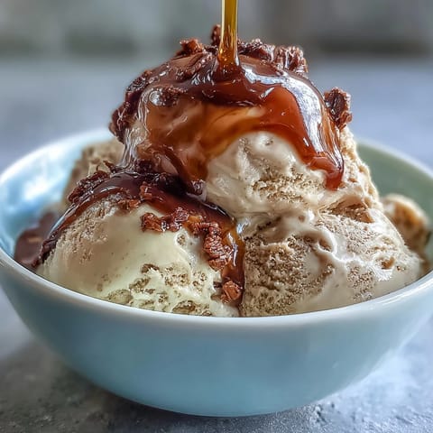 Hojicha Affogato with vanilla ice cream drowned in hot, roasted Japanese tea, served in a glass.