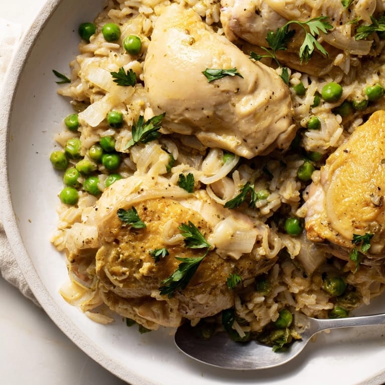 Creamy lemon chicken and rice dish in a Dutch oven, ready for easy, family-style serving.