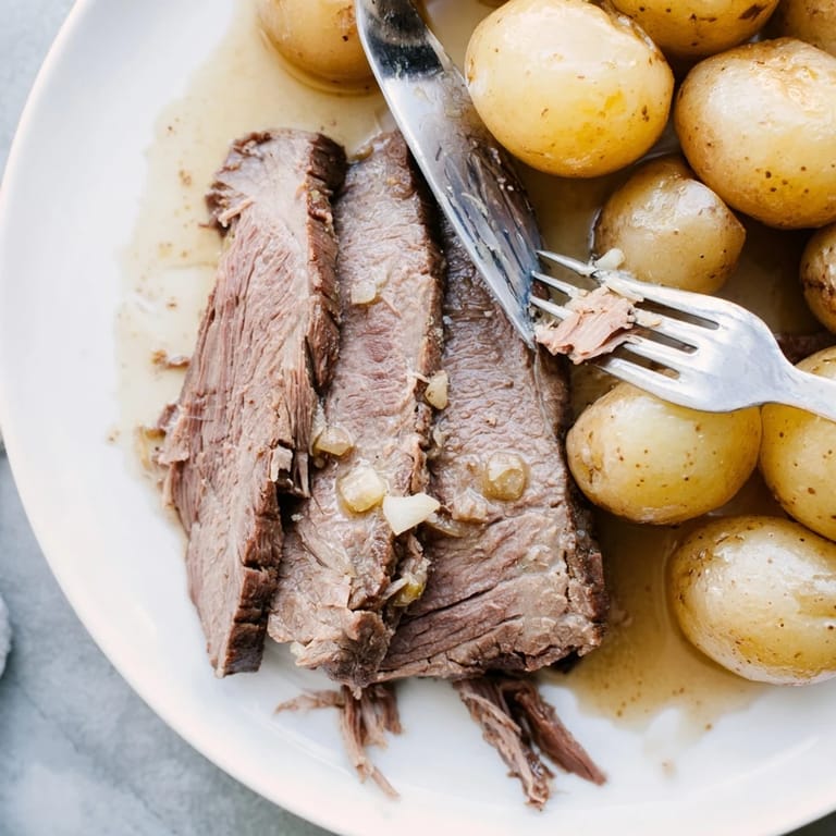 Fork-tender 4-ingredient slow cooker pot roast, a classic, comforting American main dish.