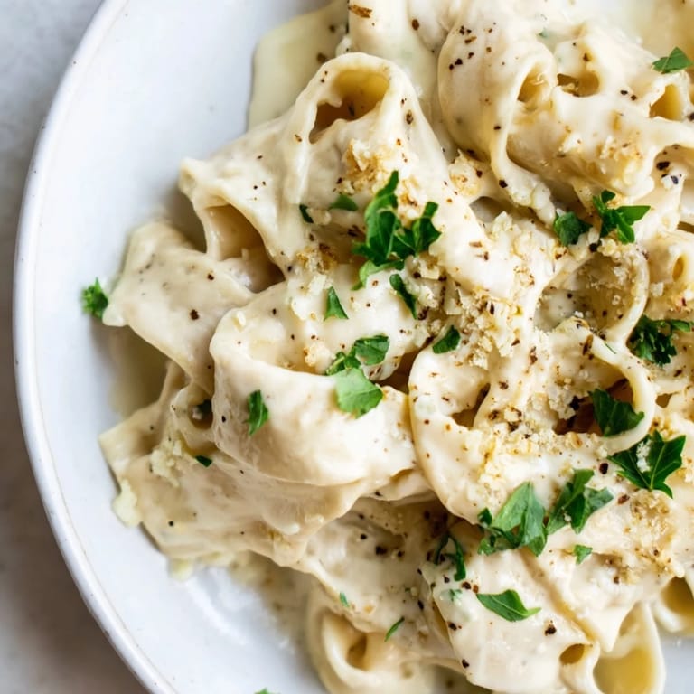 Freshly made Cottage Cheese Alfredo sauce, a lighter Alfredo bursting with garlic and Parmesan flavor, ready to serve.