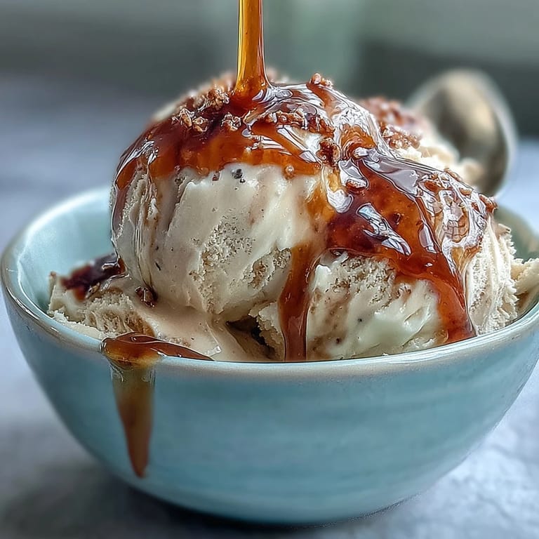 Scoops of vanilla ice cream melting into hot hojicha tea for a creamy, smoky Hojicha Affogato.